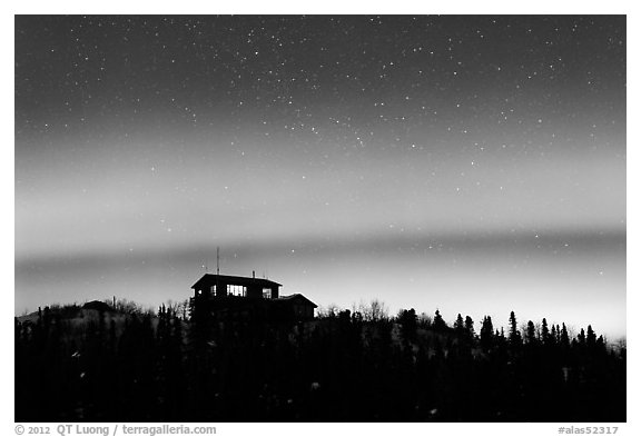 House and Northern Lights filled sky. Alaska, USA