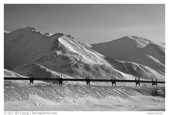 Trans Alaska Pipeline and snow-covered mountains. Alaska, USA (black and white)