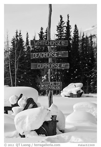 Signs in winter. Wiseman, Alaska, USA (black and white)