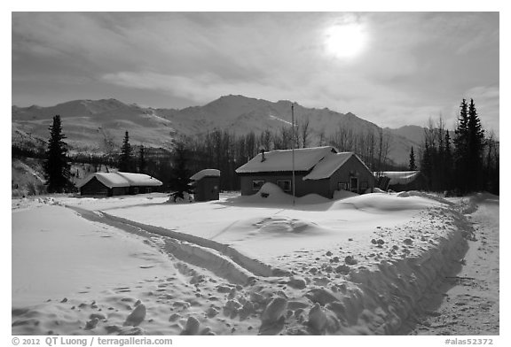 Backlit view of snow-covered village. Wiseman, Alaska, USA (black and white)