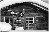 Log cabin facade with antlers. Wiseman, Alaska, USA ( black and white)