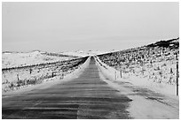 Windblown drifted snow across Dalton Highway. Alaska, USA (black and white)