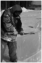 Ice artist carving with saw. Fairbanks, Alaska, USA (black and white)