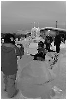Children playing on ice sculptures, Ice Alaska. Fairbanks, Alaska, USA (black and white)