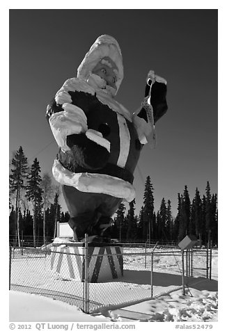 Santa Claus statue surrounded by barbed wire. North Pole, Alaska, USA