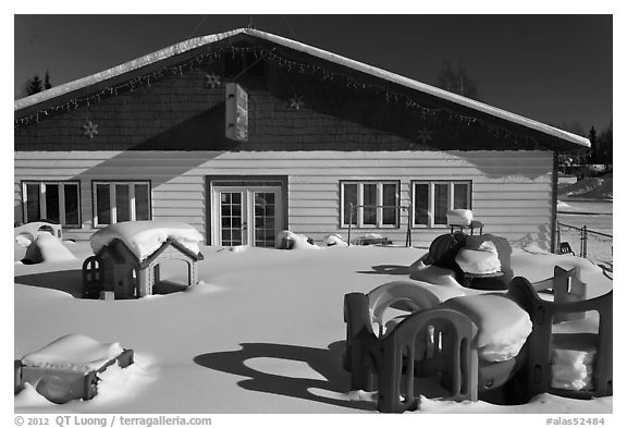 Playground in winter in front of day care. North Pole, Alaska, USA