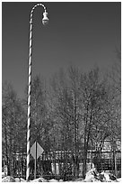 Street light decorated with a candy cane motif. North Pole, Alaska, USA (black and white)
