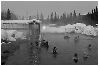 Popular outdoor hot springs, winter twilight. Chena Hot Springs, Alaska, USA (black and white)