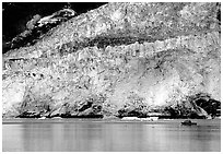 Boat at the base of Barry Glacier. Prince William Sound, Alaska, USA ( black and white)