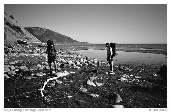 Backpackers cross a stream, Lost Coast. California, USA (black and white)