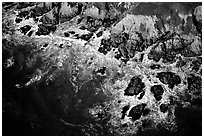 Aerial view of surf and rock. San Mateo County, California, USA ( black and white)