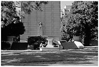 Reading at the base of the Campanile on the UC Campus. Berkeley, California, USA ( black and white)