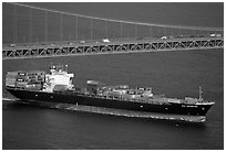 Container ship cruising under the Golden Gate Bridge. San Francisco, California, USA ( black and white)