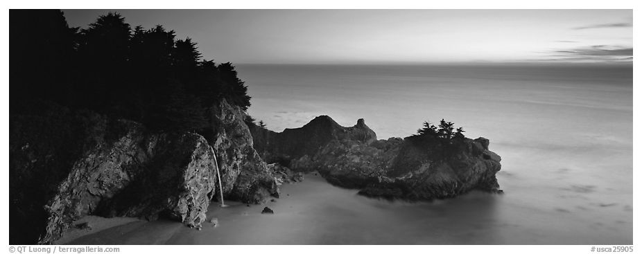 Seascape at sunset with coastal waterfall. Big Sur, California, USA (black and white)