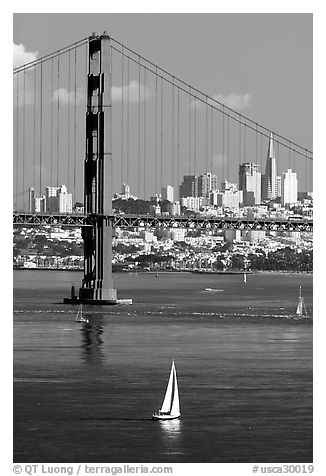 Sailboat, Golden Gate Bridge, and  city skyline, afternoon. San Francisco, California, USA (black and white)