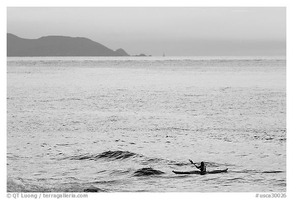 Sea kayaker, Rodeo Beach, sunset. California, USA (black and white)