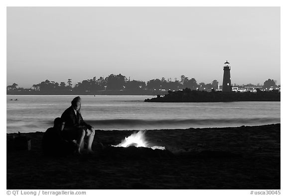Camp Fire on the beach at sunset. Santa Cruz, California, USA (black and white)