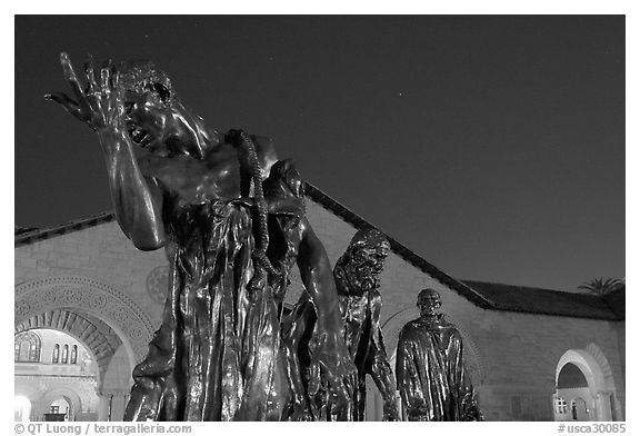 Burghers of Calais sculptures in  Quad at night. Stanford University, California, USA (black and white)