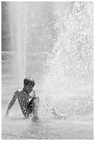 Boy playing in water,  Cesar de Chavez Park. San Jose, California, USA (black and white)