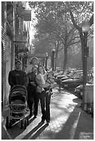 Family strolls on the sidewalk of University Avenue. Palo Alto,  California, USA (black and white)