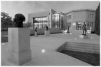 Rodin sculpture garden and Cantor Center for Visual Arts with one visitor. Stanford University, California, USA (black and white)