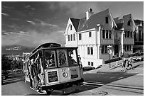Cable car climbing, and Tudor house, late afternoon. San Francisco, California, USA ( black and white)