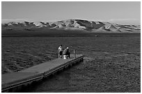 Fishing on San Luis Reservoir at sunset. California, USA ( black and white)
