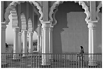 Indian girl running amongst columns of the Sikh Temple. San Jose, California, USA ( black and white)