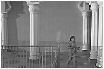Indian girl running in the Sikh Gurdwara Temple, late afternoon. San Jose, California, USA ( black and white)