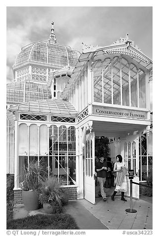 Couple exiting the Conservatory of Flowers. San Francisco, California, USA (black and white)