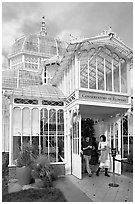 Couple exiting the Conservatory of Flowers. San Francisco, California, USA (black and white)