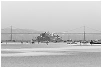 Alcatraz Island and Bay Bridge, sunset. San Francisco, California, USA (black and white)