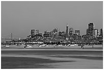 Harbor in Richardson Bay with houseboats and city skyline at dusk. San Francisco, California, USA (black and white)