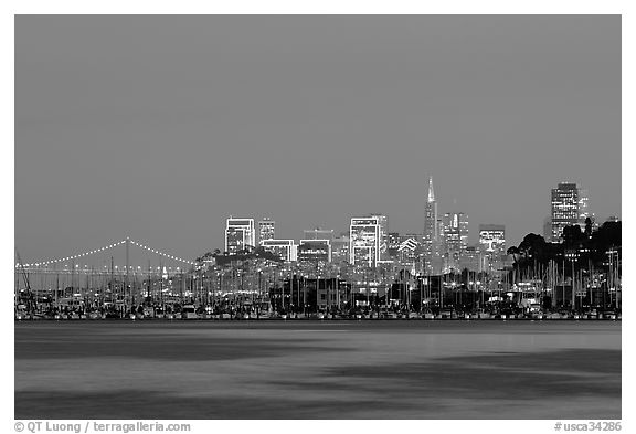 Sausalito houseboats and San Francisco skyline at night. San Francisco, California, USA