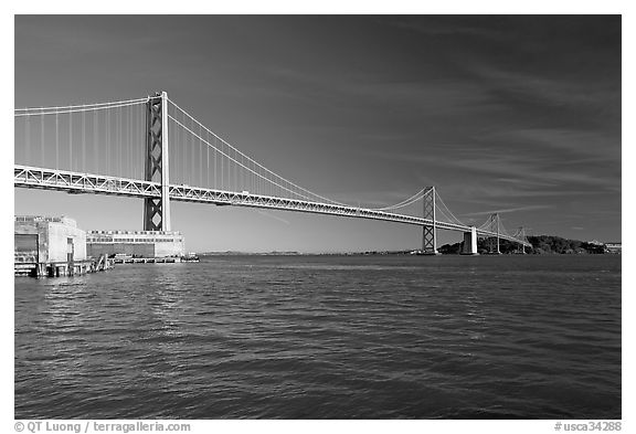 Pier, Oakland Bay Bridge, and Yerba Buena Island, early morning. San Francisco, California, USA (black and white)