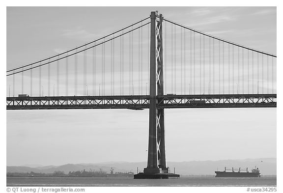 Traffic on Oakland Bay Bridge and tanker ship. San Francisco, California, USA (black and white)