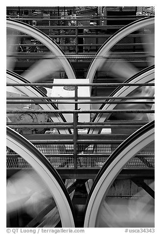 Wheels of cable winding machine in rotation. San Francisco, California, USA (black and white)