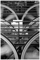 Wheels of cable winding machine in rotation. San Francisco, California, USA ( black and white)