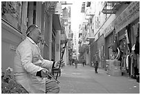 Ehru musician in Ross Alley, Chinatown. San Francisco, California, USA (black and white)