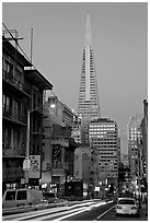 Chinatown street and Transamerica Pyramid, dusk. San Francisco, California, USA (black and white)