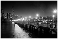 Skyline, Pier 7 lights and reflections at night. San Francisco, California, USA ( black and white)