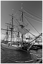 Maritime Museum with HMS Surprise and ferryboat Berkeley. San Diego, California, USA (black and white)