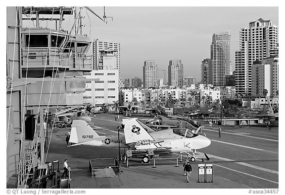 Flight control tower, aircraft, San Diego skyline, USS Midway aircraft carrier. San Diego, California, USA (black and white)