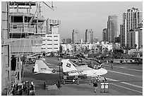 Flight control tower, aircraft, San Diego skyline, USS Midway aircraft carrier. San Diego, California, USA ( black and white)