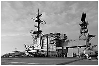 Flight deck and island, USS Midway aircraft carrier, late afternoon. San Diego, California, USA ( black and white)