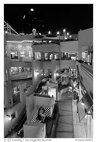 Some of the 140 stores in the Horton Plaza shopping mall at night. San Diego, California, USA