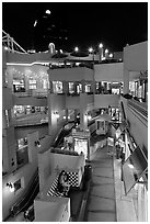 Some of the 140 stores in the Horton Plaza shopping mall at night. San Diego, California, USA ( black and white)