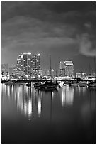 Yachts and skyline from Harbor Drive, at night. San Diego, California, USA (black and white)