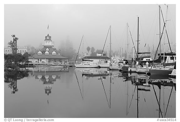 Boats and historic Coronado boathouse in fog. San Diego, California, USA