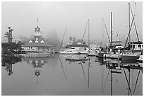 Boats and historic Coronado boathouse in fog. San Diego, California, USA (black and white)
